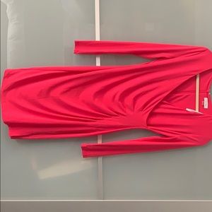 Long sleeve pink knee length dress. Faux wrap